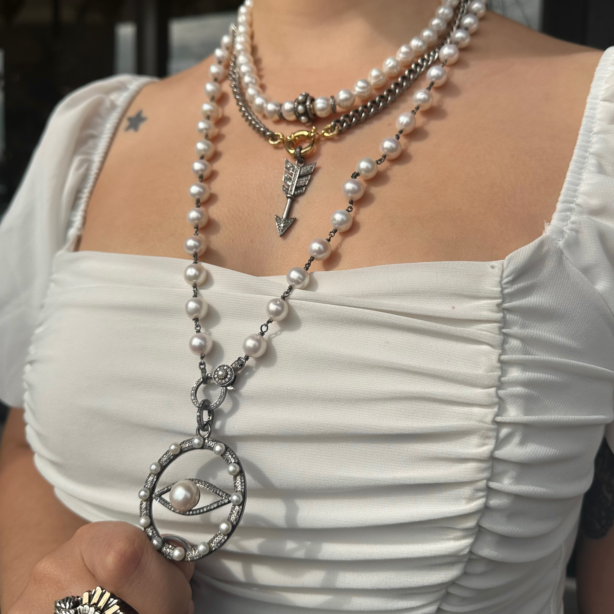 Pearl necklace with online eye